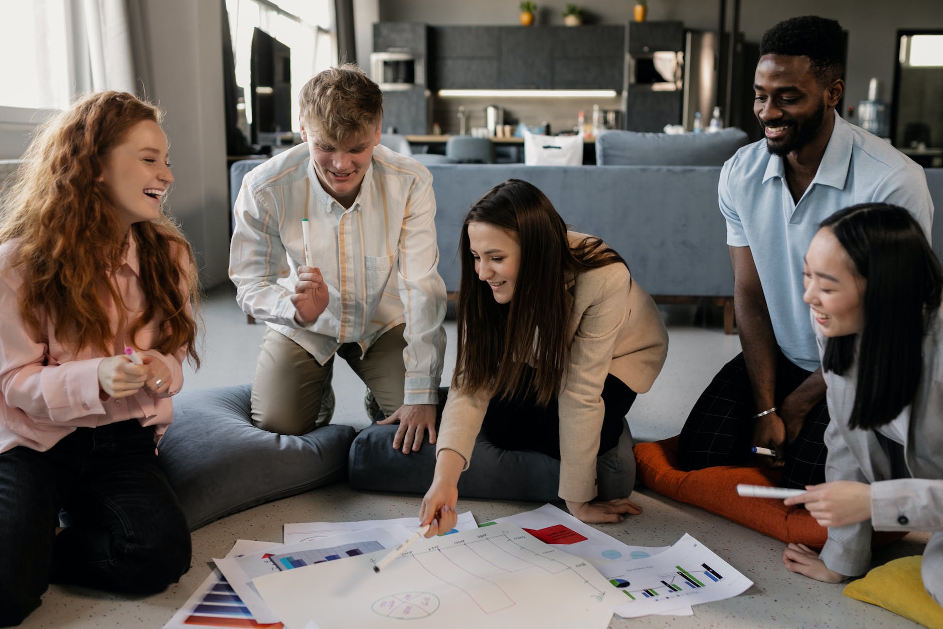 a group of people having a meeting in the office